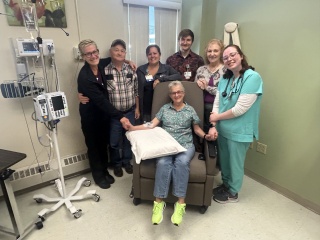 Group photo of Flora and Doug Doyle with ECH's Infusion Team