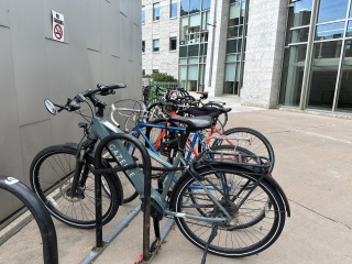 Ebikes parked in bike rack outside of UVM Medical Center