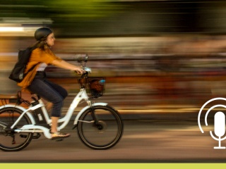 Blurred photo of a woman on an e-bike