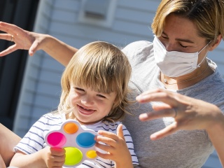 Henry Saladino plays with his mom outside.