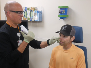 A medical provider does a Flexible Endoscopic Evaluation of Swallowing for dysphagia on a patient.