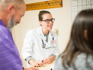 A female doctor speaks with a patient.