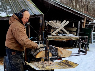 TAVR patient Varney splits and cuts wood at his home