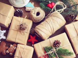 Gift boxes sit on a wooden background.