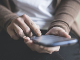Person holding a phone.