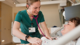 An Elizabethtown Community Hospital Nurse listens to a patients heart in the Inpatient Unit of the hospital.