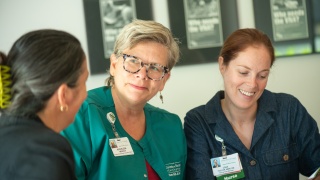 Home Health & Hospice staff conversing.