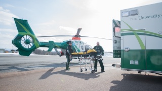 Regional transport service vehicles, including a helicopter and an ambulance.