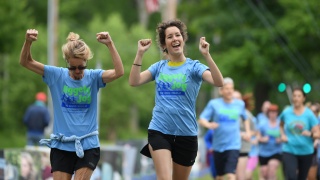Runners celebrate at the finish line of the Home Health & Hospice Jiggety Jog Fun Run.