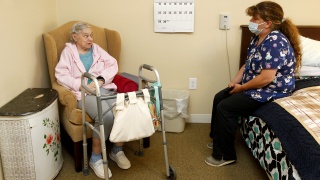Resident chats with Home Health Aide at Alice Hyde Medical Center’s Alice Center Assisted Living in Malone, NY.