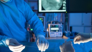 Close-up of medical professionals prepping for a surgery,