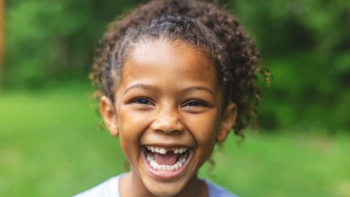 Photo of smiling child.