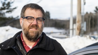 Ian Campbell stands outside for a photo.