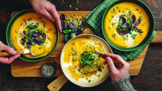 Bowls of curried squash soup.