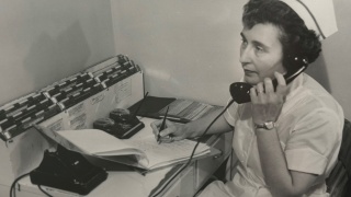 Historical photo of nurse on the phone at Porter Medical Center.