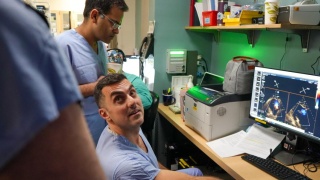 Rony Lahoud, MD and Tanush Gupta, MD, look at imaging