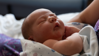 Close-up photo of a newborn baby.