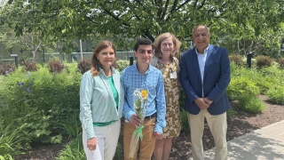 Bijan Salimi poses with family and Jill Bowen, PhD