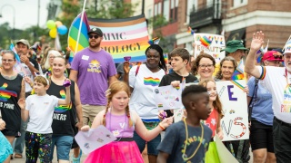 Community members march during the pride parade in Burlington.