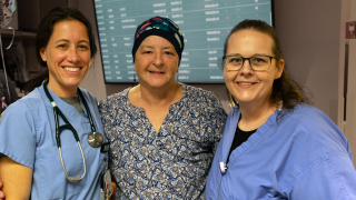 Three nurses pose for a photo in the hospital.