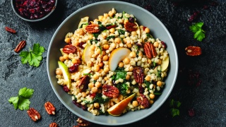 Couscous salad with kale, pear, cranberries and pecans.