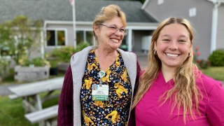 Sheila Kleptz and Amber Doyle, LNAs with Home Health & Hospice, pose for a photo outside.
