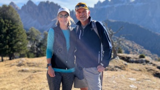 Photo of Kate and Mitch Mitchell on a hike in the Dolomites.