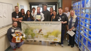 Ladd Osborne, MD, an emergency physician at Champlain Valley Physicians Hospital, was surprised as the most recent BEE Award honoree during a ceremony with his co-workers.