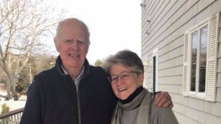 Pam and Bruce MacPherson pose for a photo outside.