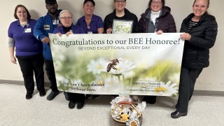 Geri Kaplan-Downs, who works in nutrition and patient accounting at Champlain Valley Physicians Hospital, was surprised as the most recent BEE Award honoree during a ceremony with her co-workers. 