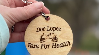 Close up of a token showing Doc Lopez Run for Health.