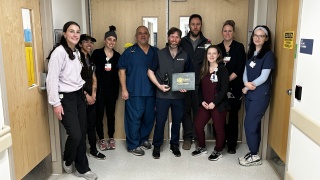 The Emergency Department team at Elizabethtown Community Hospital celebrates the DAISY Award presented to colleague Judd Collier, RN during a surprise ceremony. The DAISY Award recognizes nurses who make a meaningful difference in the lives of their patients and is based on nominations from patients, families and co-workers.
