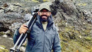 Portrait of Paul El Azoury, MD, hiking with his camera and tripod.