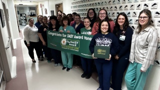 The Labor and Delivery team at Champlain Valley Physicians Hospital celebrates the DAISY Award presented to colleague Cindy Tate-Gutierrez, RN during a surprise ceremony. The DAISY Award recognizes nurses who make a meaningful difference in the lives of their patients and is based on nominations from patients, families and co-workers.