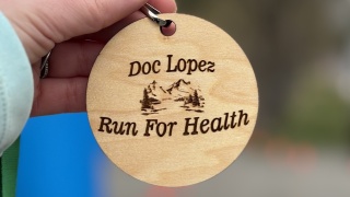 Up close on a badge of the doc lopez run for health.