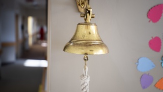 Close-up of the survivorship bell in the cancer center.