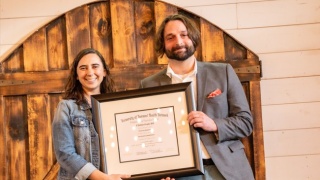 CVPH Family Medicine Residency Faculty member Delaney Osborn, MD, left, presents graduate Nicholas Rzepski, MD with his certificate of completion at the Residency’s commencement ceremony held June 19 at the Rainbow Banquet Hall, Altona. Dr. Rzepski, who has joined Hudson Health Headwaters, was one of seven graduates celebrated at the event. 