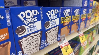 Close up of protein pop tarts on a grocery aisle shelf.