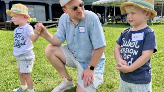 A family attends the Golisano Children's Hospital NICU reunion at Shelburne Farms.