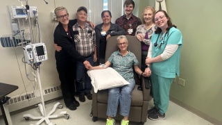 Group photo of Flora and Doug Doyle with ECH's Infusion Team