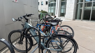 Ebikes parked in bike rack outside of UVM Medical Center