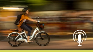 Blurred photo of a woman on an e-bike