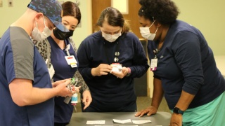 Graduates of the CVPH Nursing Residency program participating in an escape room challenge.