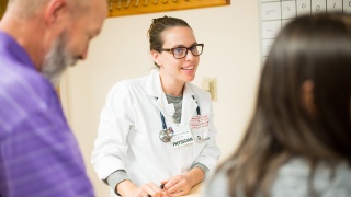 A female doctor speaks with a patient.