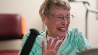 Older woman smiling while exercising