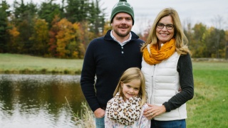 Houskeeper family by a pond.