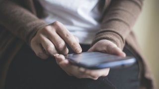 Person holding a phone.
