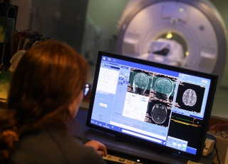 A radiologist looks at the result of a brain scan.