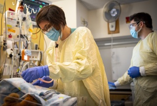 A medical provider cleans her equipment.