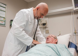 Alice Hyde Medical Center doctor Gary Starr examines a patient in the Emergency Department in Malone, NY.